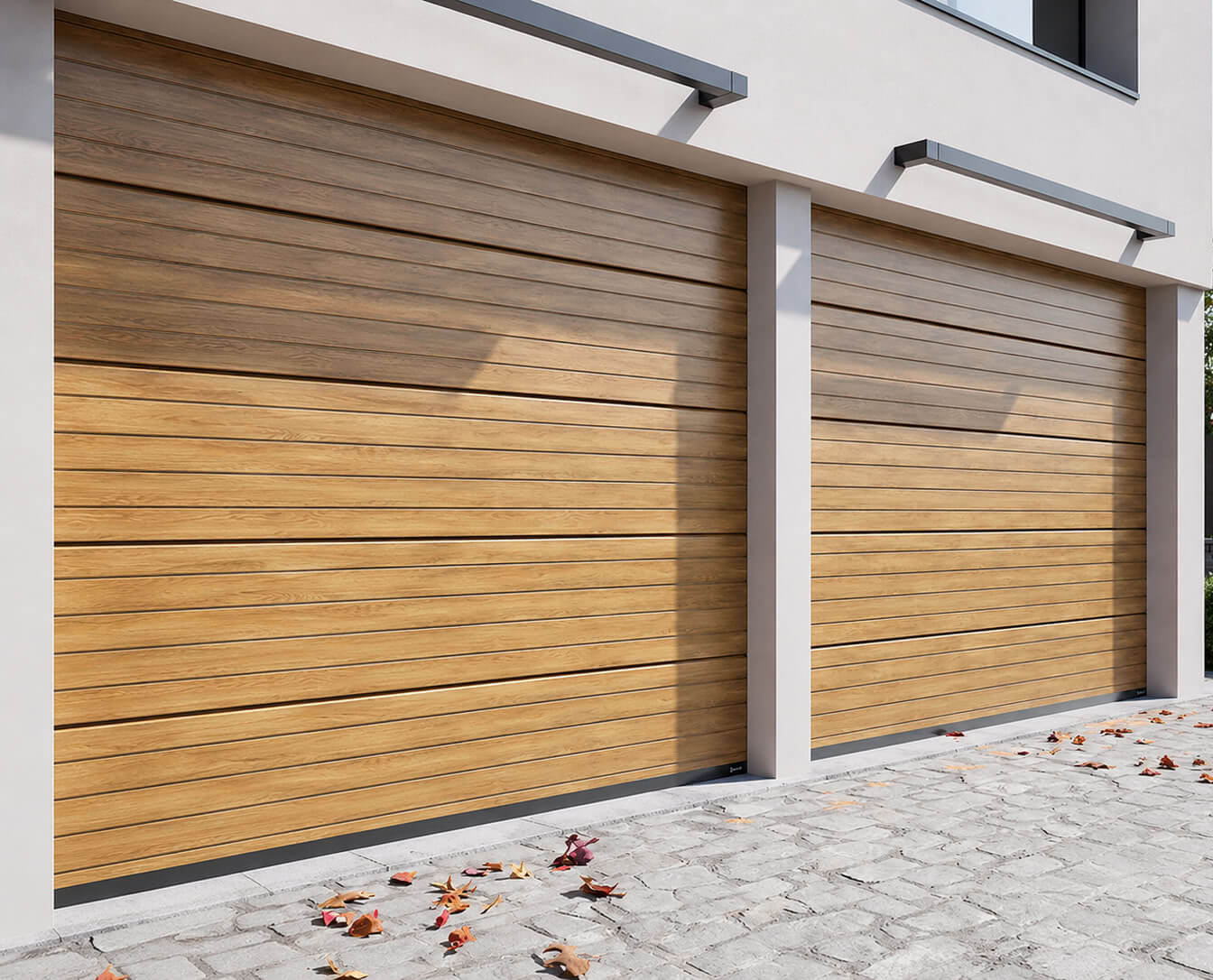 Two D-GATE sectional garage doors in a wood-look finish on a modern home facade