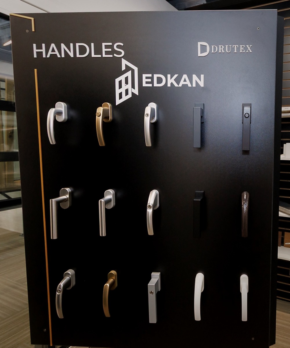 EDKAN and Drutex hardware handle display with European window and door handle options