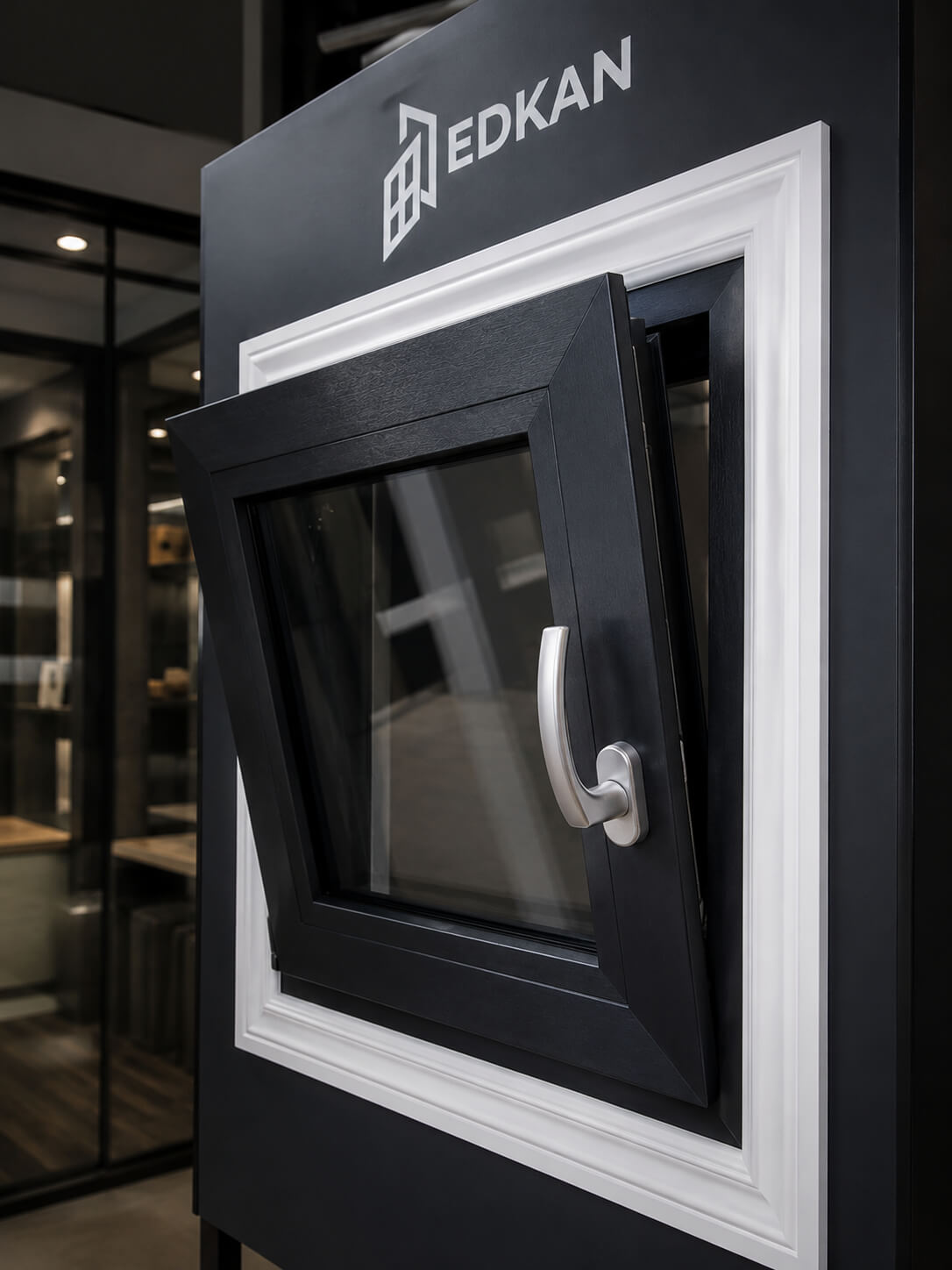 Black EDKAN tilt-and-turn window in the open position on the showroom stand